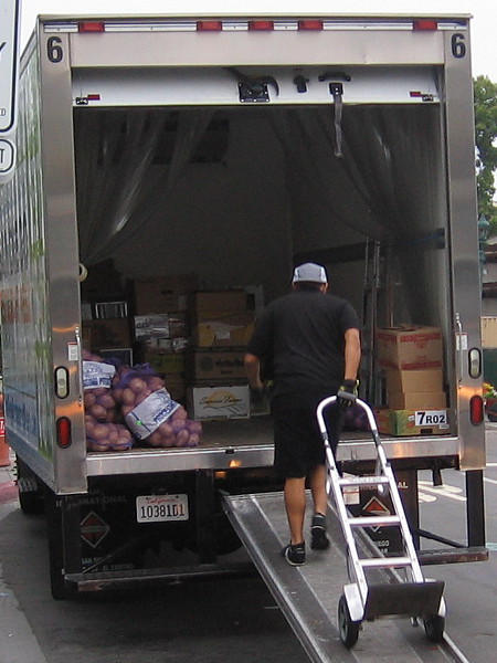 Pulling the dolly up a ramp, getting ready to retrieve potatoes and other fresh ingredients for a tasty Italian meal.