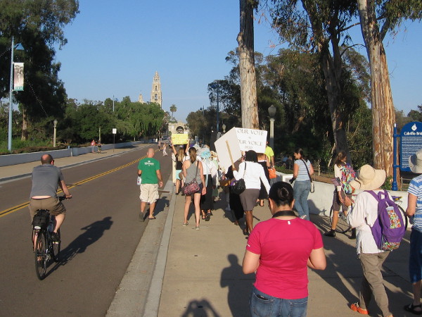 The suffrage parade begins toward the heart of Balboa Park, down El Prado and over the Cabrillo Bridge.