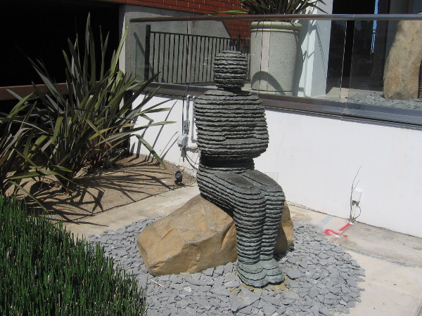 Unusual human sculpture sits near the sidewalk outside La Jolla's Madison Gallery.