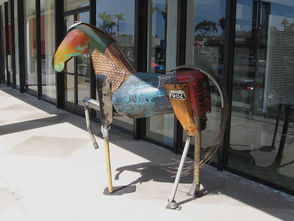 This cool horse outside a Madison Gallery window was created with large pieces of junk and old machine parts.