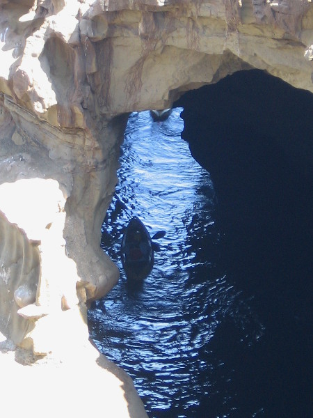 Drawn forward into the unknown, the courageous kayakers paddle forward along the dancing sliver of light. They are explorers. Life is a great adventure.