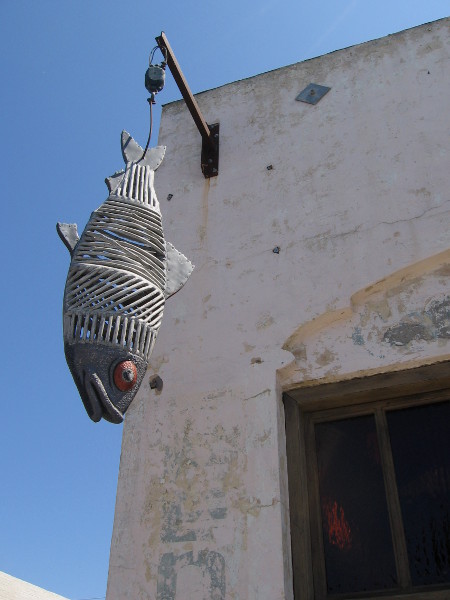 A cool fish dangles in front of the Herringbone Restaurant.