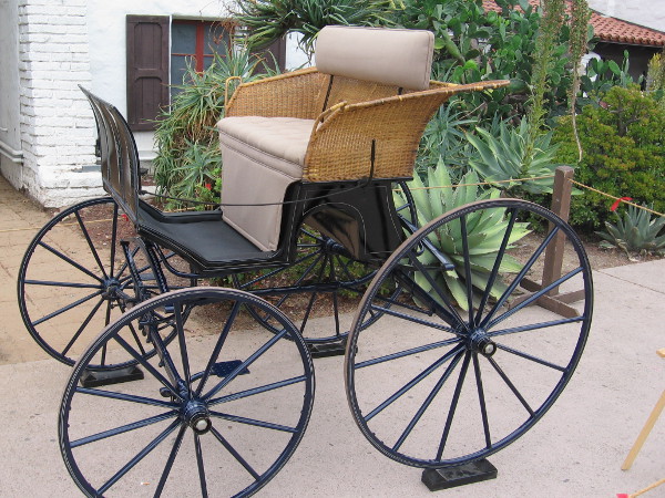 A ladies basket trap carriage, circa 1900. This simple horse-drawn vehicle was often used for comfortable country travel, complete with wicker basket seat.