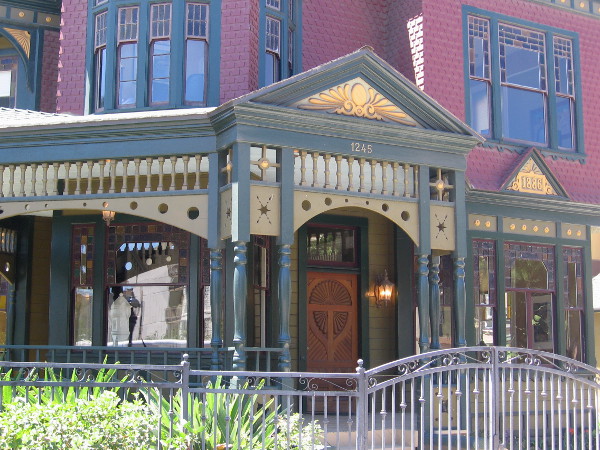 Lots of decorative details include an elaborate porch and stained glass crowning every window.
