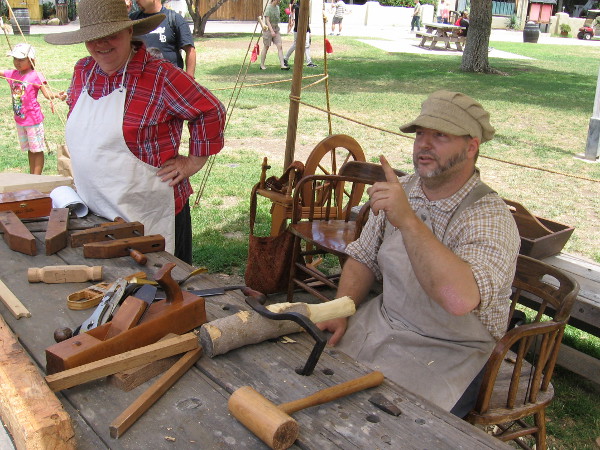A cool woodworker demonstrates and provides the names of his many tools to the delight of watching kids.