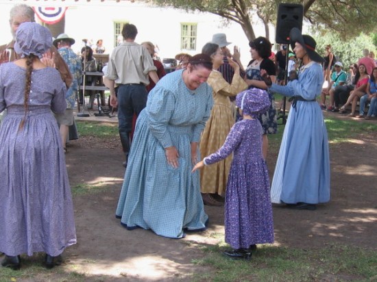 Two ladies prepare to dance the polka.