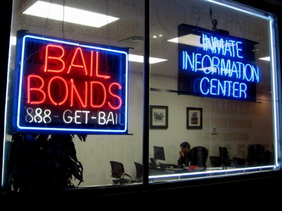 Glowing neon Bail Bonds advertisement at this open-all-night Inmate Information Center.