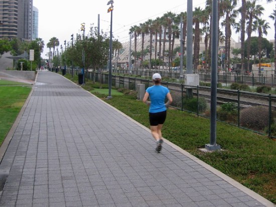 A lone jogger heads down Martin Luther King Jr. Promenade while many San Diegans are still in bed.