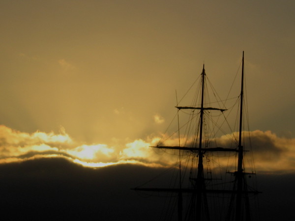 Masts of tall ship Californian, of the Maritime Museum of San Diego, and a brilliant sunset. Unlike a fictional whale, these beautiful things are quite easily seen.
