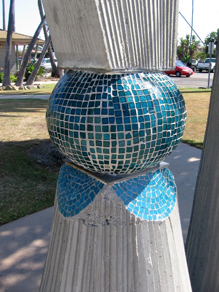 One column contains a pearl-like globe of shining blue tiles.