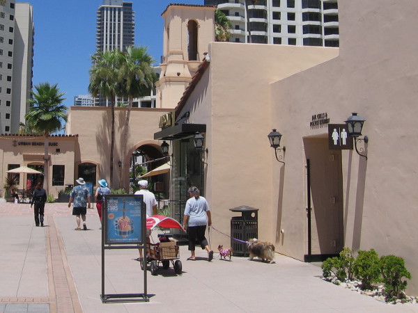 People amble past a doorway which leads into the past. A bit of San Diego history beckons the curious.