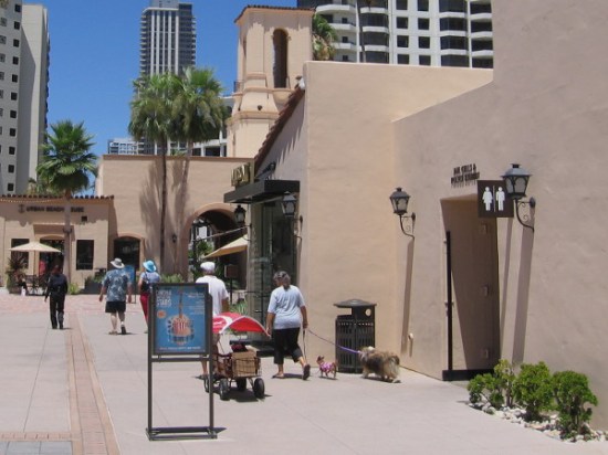 People amble past a doorway which leads into the past. A bit of San Diego history beckons the curious.