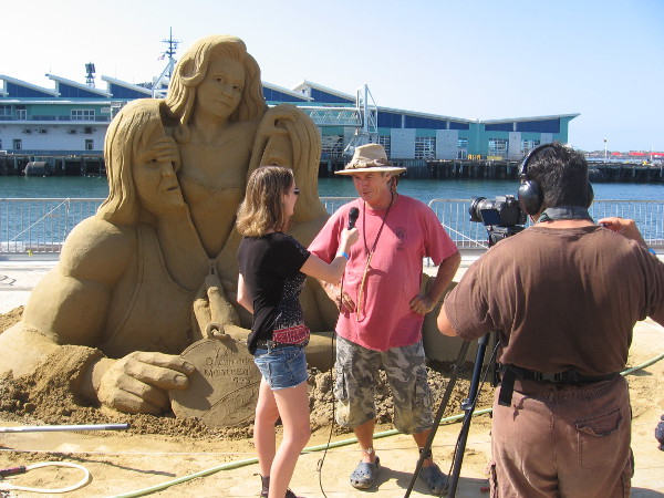 John Gowdy is interviewed by a video production crew at the 2015 U.S. Sand Sculpting Challenge.