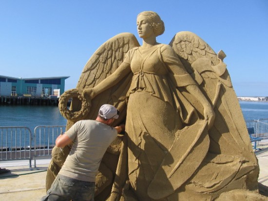 Carefully working beneath a wing and Olympic olive wreath on a sunny San Diego Labor Day weekend.
