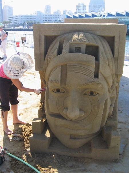 An interesting face decorates one end of the complicated multi-part sand sculpture.