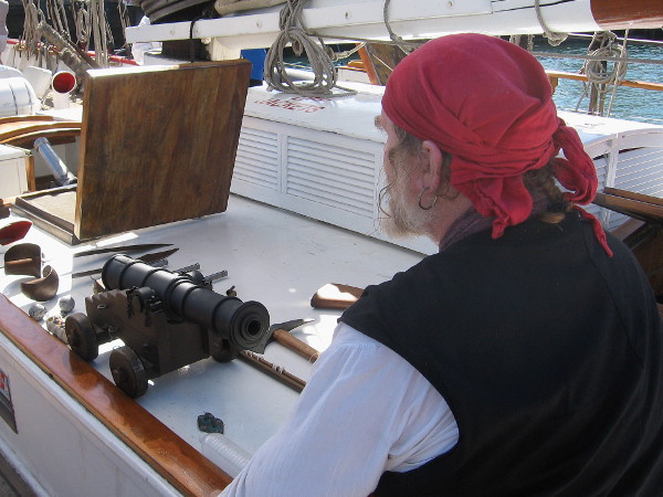 Bill of Rights tall ship crew members were dressed in seafaring costumes. This pirate had a collection of pistols and a small cannon on display.