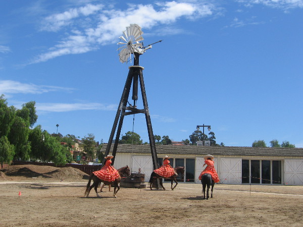 Beautifully costumed riders of the female equestrian group Escaramuza Las Golondrinas warm up behind Seeley Stable Museum in Old Town San Diego.