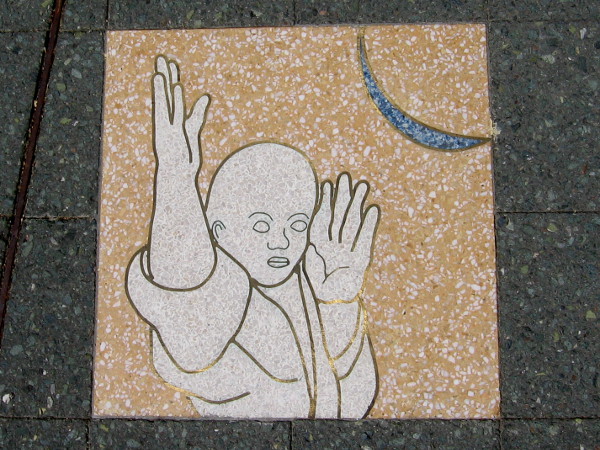 Human figure poses beneath the slender blue moon. That moon will transform as the narrative moves counter-clockwise around the circle.