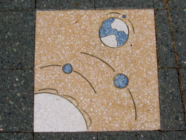 Our big blue marble is third planet from the sun. It has its own small orbiting moon.