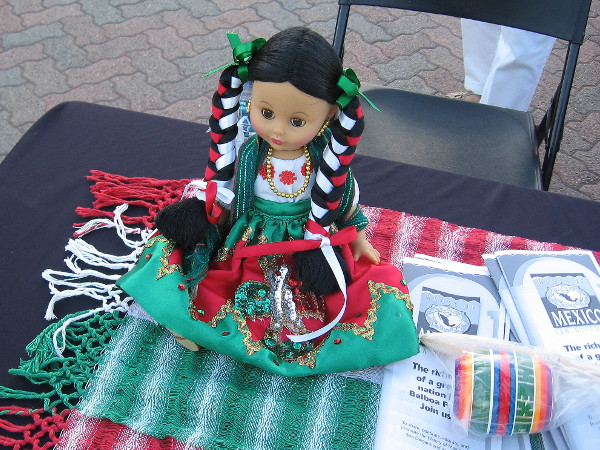 Doll greets visitors at Friday evening House of Mexico event in Balboa Park.