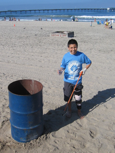 This cool kid showed me a bit of plastic he picked up with his nifty grappler.