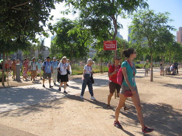 And here they come! Guides with Trolley Dances signs lead the way to the first unusual outdoor dance site.