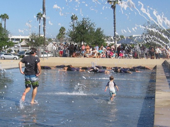 OH, NO!!! A child playing in the park nearby is heading out to join the dancers! Horrors!