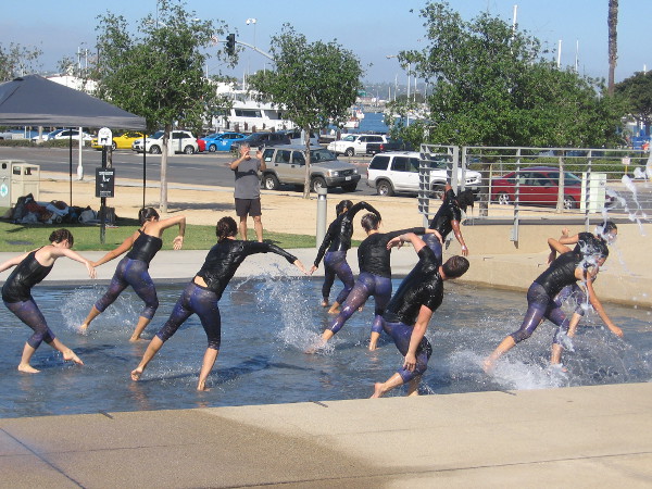 Now the dancers rise in unison, plunging forward, swirling, alive!