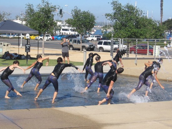 Now the dancers rise in unison, plunging forward, swirling, alive!