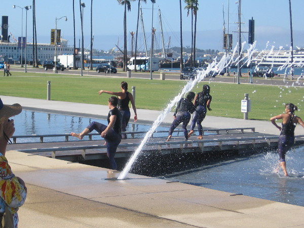 The dancers are now clearly moving away from the audience, pushing out into the broader world, over this bridge.