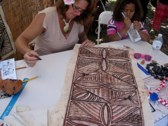 Artist representing Samoa creates Siapo, also known as tapa, using ink made from native seeds and tree bark.