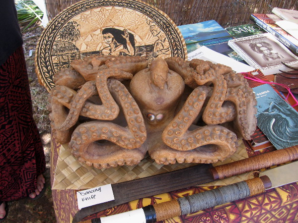 A funny octopus and dancing knife on display at the Samoa tent.