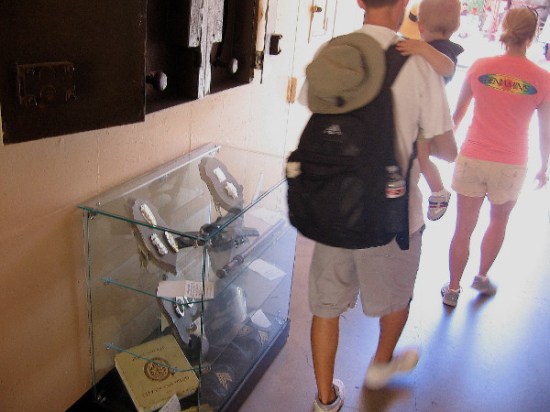 Display cases in this preserved hallway contain artifacts from local law enforcement decades ago.