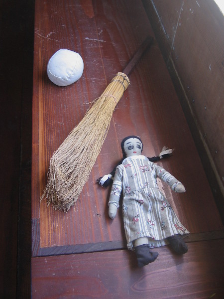 A ball, broom and doll.