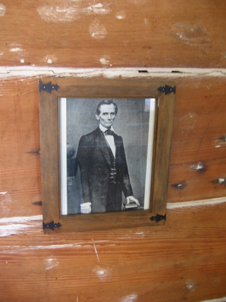 Photographic portrait of President Abraham Lincoln on a primitive wall. Mason Street School was San Diego's first schoolhouse, built in 1865 at the end of the Civil War.