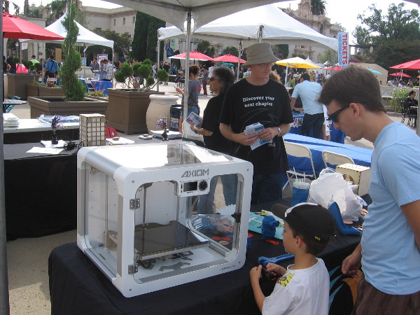 Checking out a 3D printer at the San Diego Public Library table at Maker Faire. The library is about to expand their Innovation Lab and will have nine 3D printers!