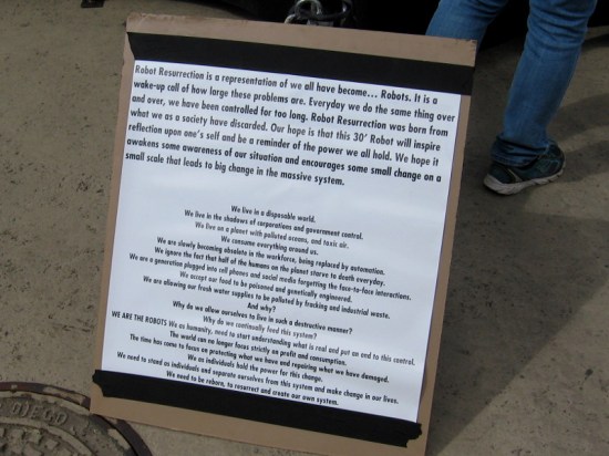 According to Shane Evans, maker of the giant robot, we humans have all become automatons in a highly controlled world.