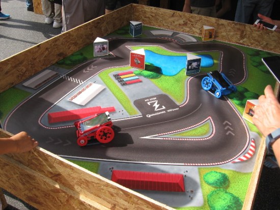 Local company Qualcomm had a large exhibit showcasing their electronic chips, some drones, and this little remote control race course which utilizes smart phones.