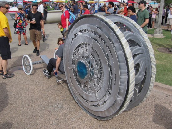 But his big wheel can't compare to this! Coming down El Prado, this awesome personal transportation doohickey looks like it arrived from another world!