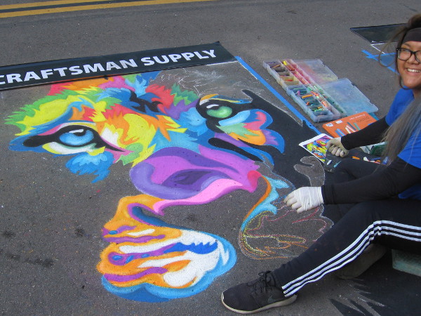 Meg. A big smile and a boldly colored work of chalk art taking form on a San Diego street during Festa!