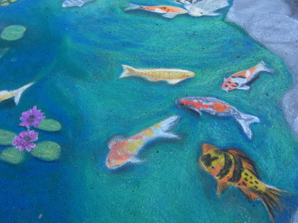 Lydia Puentes Phillips. Very color koi swimming in the Balboa Park reflecting pool. Great chalk art that captures one of my favorite places!