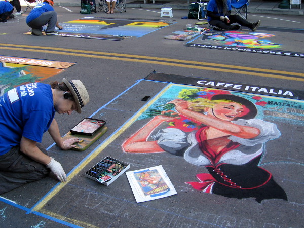 Soon thousands will crowd the street to enjoy this great chalk art. I swung by early and got photos of works in progress!