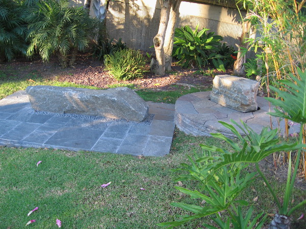 Two beautiful stone benches invite meditation.