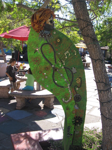 This fun art in Spanish Village contains elements of steampunk, a sub-genre of science fiction that highlights 19th century Victorian and industrial themes.