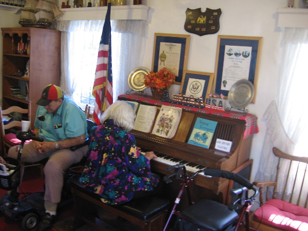 Playing the piano for anyone who wanders in on another perfect sunny San Diego day. Someone was whistling nearby.