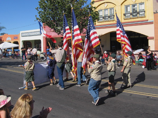 The Boy Scouts parade the colors down Main Street in El Cajon.