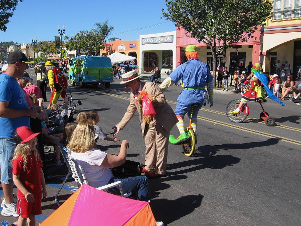 A bunch of wacky clowns following the Scooby Doo Mystery Machine made lots of people smile.
