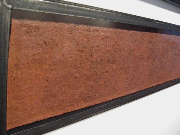 Jim Wilsterman, Rain Event #10, 2011. Earth, fiber, raindrops. Somewhere between photograph, sculpture and painting, this art has recorded rainfall using clay and mud.