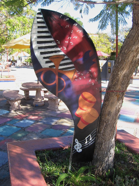 This panel celebrates the Art Deco style with images of musical instruments popular in the Jazz Age.