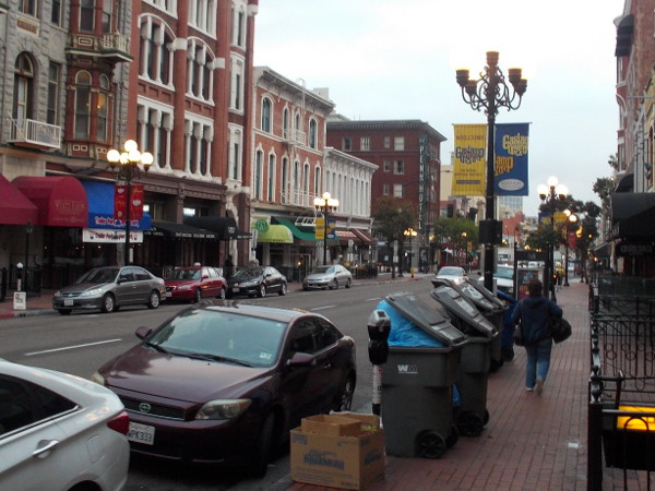 Rows of garbage receptacles in the Gaslamp. The remnants of good times.